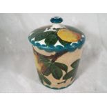 A Wemyss lidded storage jar decorated with depictions of apples,