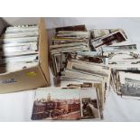 A box containing in excess of 500 early to mid period UK topographical and some foreign postcards