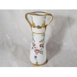 A MacIntyre / Moorcroft Pottery twin-handled tapered vase decorated with roses and garlands on an