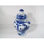 A Chinese blue and white covered vase, four character mark to the base with blue double circle mark,