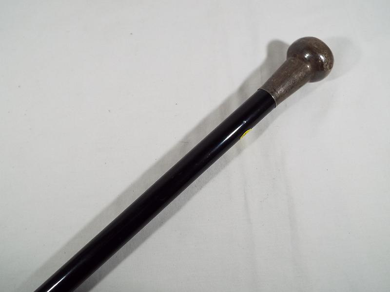 A gentleman's ebony walking cane with silver hallmarked bulbous top, - Image 2 of 2