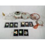 A good mixed lot to include ceramic floral brooches, perfume bottles,