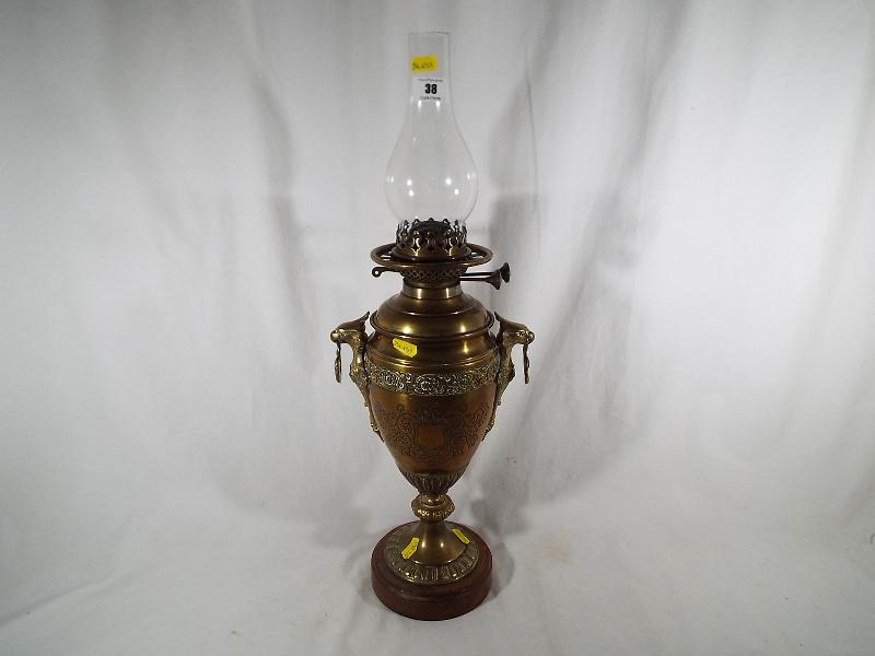 A Wright & Butler improved Duplex burner oil lamp,