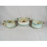 A Royal Worcester three piece tea set comprising milk jug and two bowls,