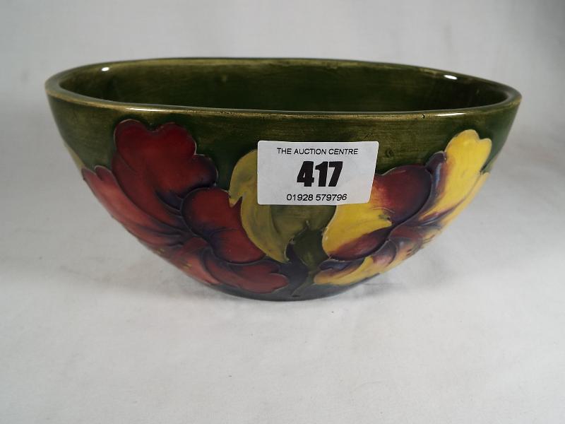 A Moorcroft Pottery oval planter decorated with coral hibiscus on a green ground, - Image 2 of 3