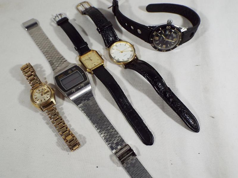 A mixed lot of five wristwatches to include two lady's watches by Tissot and Seiko,