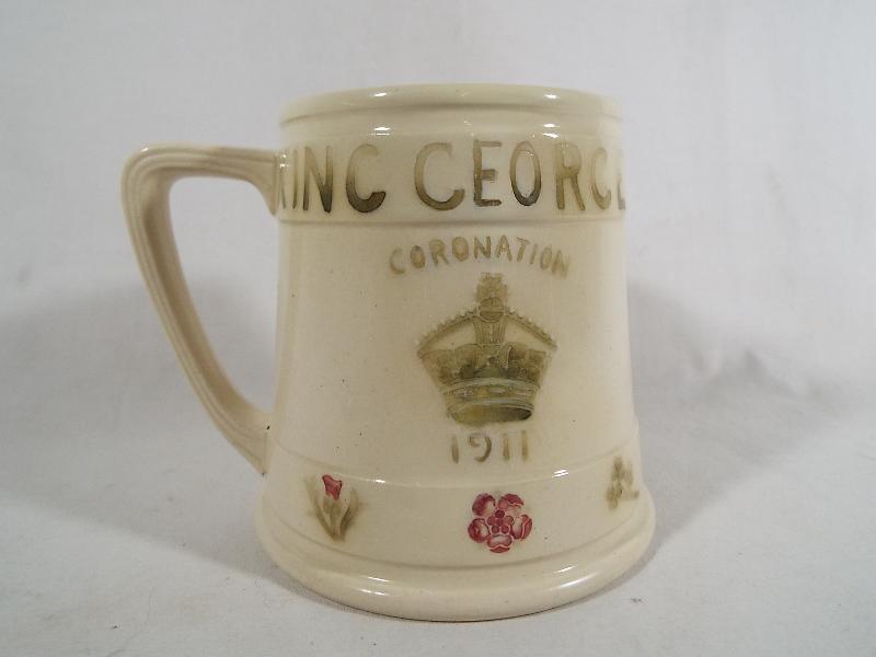 A Moorcroft Pottery Royal commemorative mug, George V Coronation 1911,