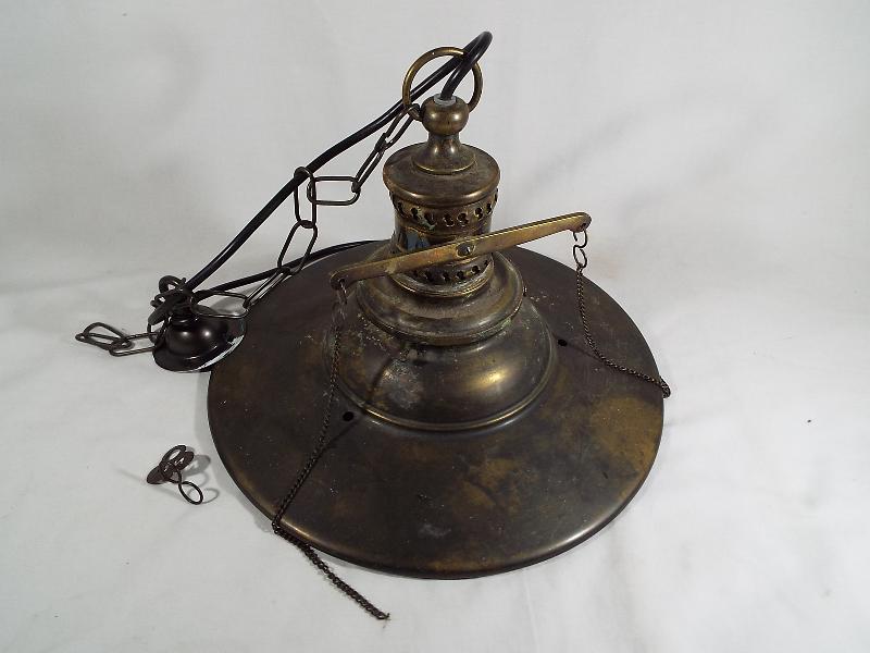 A brass converted gas electric ceiling light,