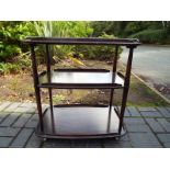 A mid century three tiered tea trolley