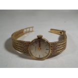A lady's 9 carat gold wristwatch  by  Garrard, case weight 15g,