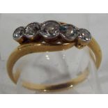 A lady's 18ct gold five stone old cut cross over diamond ring, size L1/2, approximate weight 2.