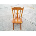 A good quality pine kitchen chair with spindle back