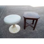 A retro fibreglass and leather button stool,