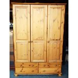 A good quality pine 3 door wardrobe over 4 drawers 185 cm x 128 cm x 53 cm