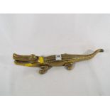 A heavy good quality brass crocodile nut cracker marked to the base with makers mark,