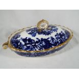 A Copeland Spode lidded twin-handled tureen, blue and white with gilded accents,