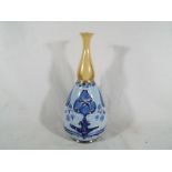 A James MacIntyre Gesso Faience / Florian Ware vase,