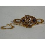 A lady's Chester hallmarked 15ct sapphire and pearl brooch,