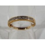 A lady's 9ct gold half eternity ring set with diamonds, size P1/2, approximate weight 9.