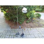 A chrome floor standing lamp and a black table top lamps (2)