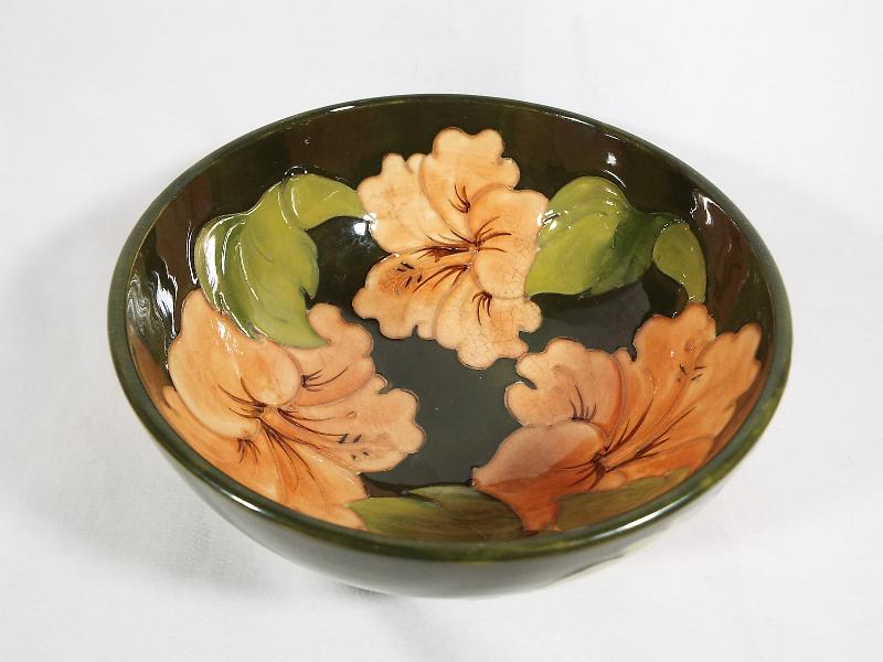 A Moorcroft Pottery pedestal bowl, decorated with hibiscus on a green ground, 7.
