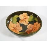 A Moorcroft Pottery pedestal bowl, decorated with hibiscus on a green ground, 7.