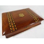 A mahogany stationery case with inlaid marquetry in the form of a book, fitted interior,