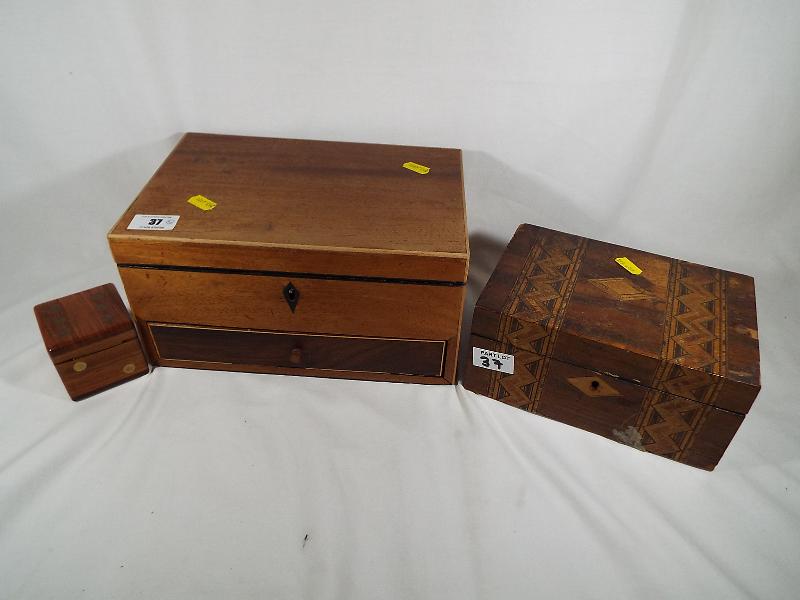 A collection of wooden boxes and chests to include an inlaid box with single hinge, felt lined,