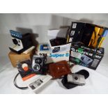 A good mixed lot of vintage cameras to include a Lubitel2, a Polaroid Land camera, a Fuji digital,