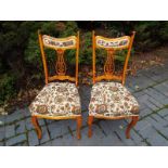 A pair of lyre-back chairs with upholstered seats - (2)
