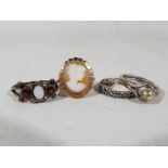 Four lady's rings to include a yellow metal cameo ring,