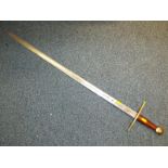 An ornamental sword, the blade bearing royal crest,