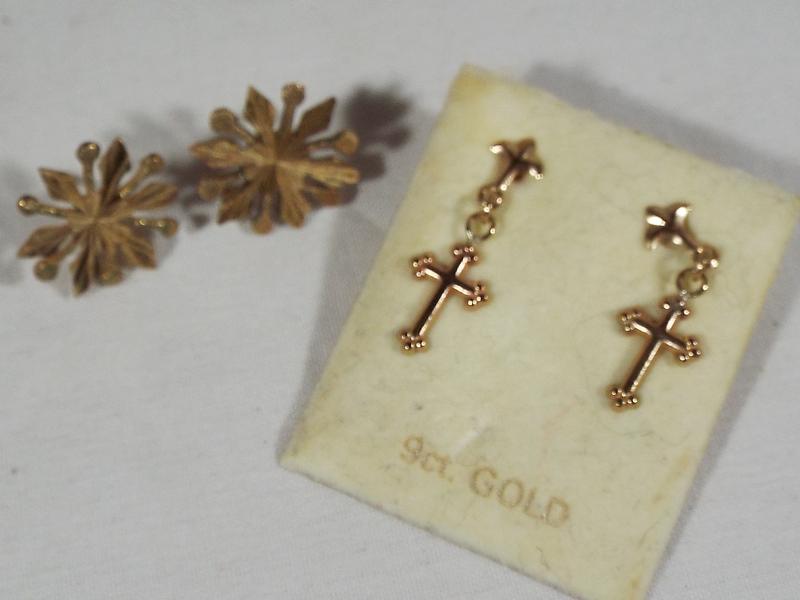 A pair of 9ct gold lady's snowflake style earrings and a further pair of earrings,