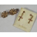 A pair of 9ct gold lady's snowflake style earrings and a further pair of earrings,