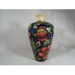 A Moorcroft Pottery modern vase decorated in a pink floral design, 15.
