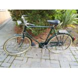 A vintage Raleigh bicycle with 23 inch wheels (racing green)