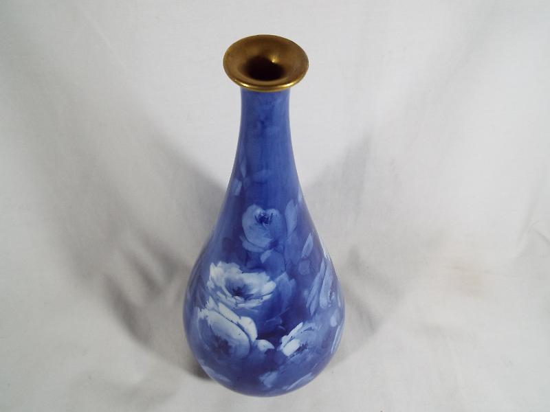 A Royal Doulton Corolian ware bulbous vase with a tapered neck decorated on a cobalt blue ground - Image 2 of 3