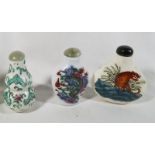 Three Chinese hand painted porcelain snuff bottles with hard stone stoppers,