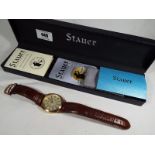 A gentleman's Stauer Quartermain wristwatch, brown leather strap,
