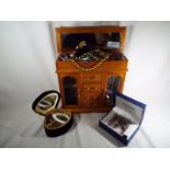 A wooden jewellery box containing a large collection of costume jewellery (qty)