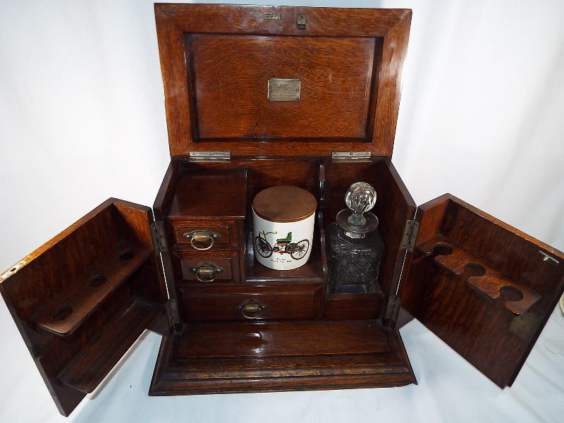 An smoker's oak cased cabinet with presentation plaque dated 1928, - Image 2 of 4