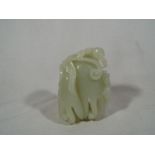 A pale celadon jade carving depicting a squid,