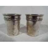Two silver shot glasses in the form of buckets marked to the base 800 och frefes sports 9002