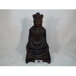 A Chinese / Tibetan Ming style bronze cold painted black red and gilt figure of a Buddha ( possibly