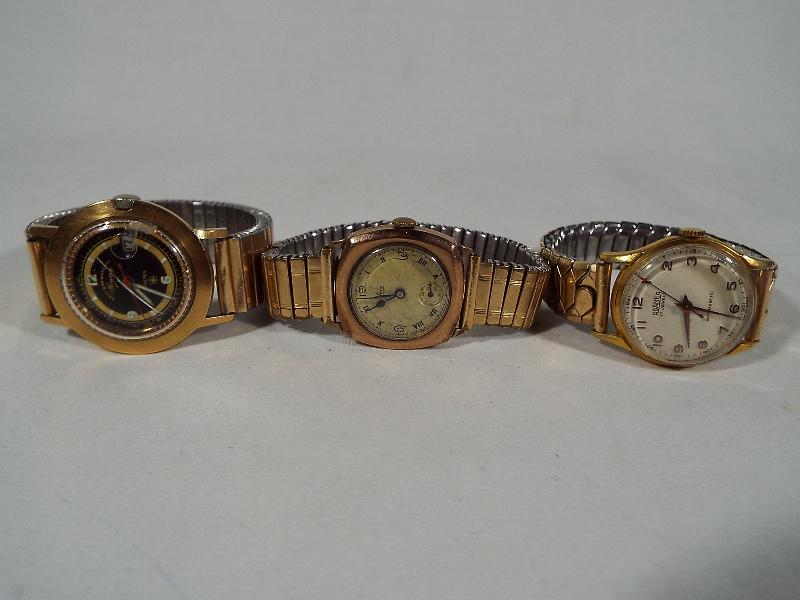 Three gentleman's wristwatches to include a cushion moulded model by Avia,