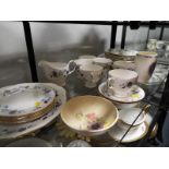 A quantity of 33 pieces of ceramic tableware by Colclough decorated with a floral pattern,