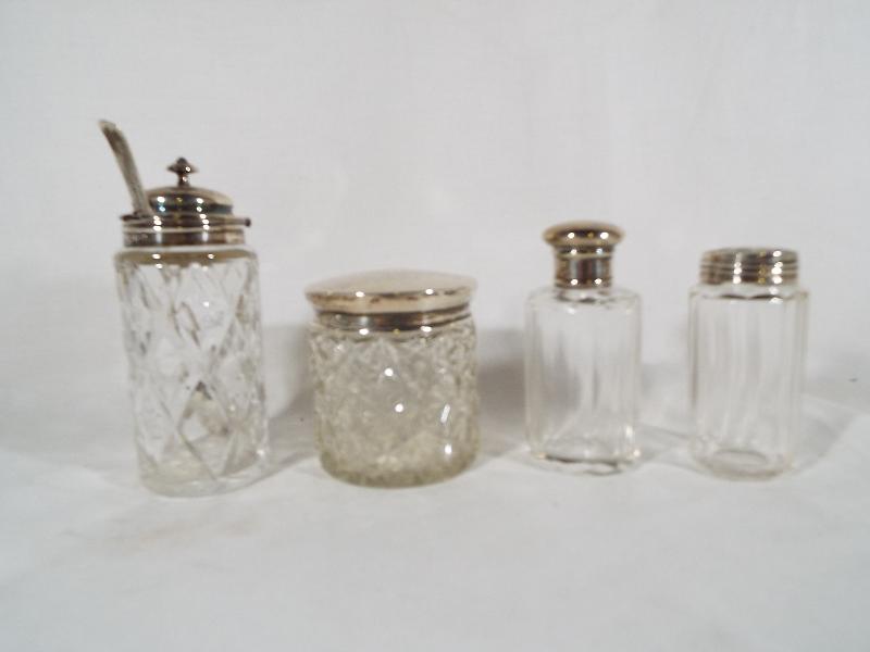 Four glass jars, all with hallmarked silver caps / mounts, - Image 2 of 2