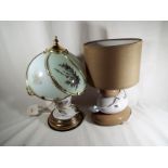A pair of table lamps one in a Tiffany style, the other a touch light,