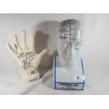 A ceramic Phrenology educational head and hand
