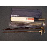 A good mixed lot to include three walking sticks, a snooker cue (boxed),